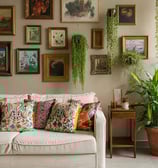 a couch with pillows and pillows on a wall