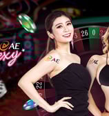 two women in bikinis playing roulet at a casino