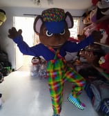 a person in a clown costume standing in a roomS DE PAW PATROL EN GREENVILLE