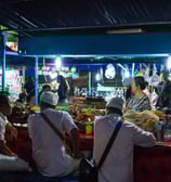 bali food tour: at night market a food vendor