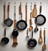 Kitchenware displayed on wall by art of kitchen