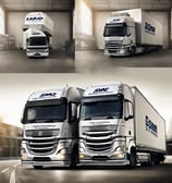 A large cargo ship travels along a river, carrying multiple colorful containers. There are green trees lining the riverbanks and a buoy floating in the water. The sky above is mostly covered with dark, thick clouds, suggesting the possibility of an approaching storm.