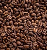 a pile of coffee beans and coffee beans hamer candy