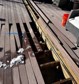 a deck with joists needing repair