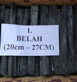 a box of black slates with a sign that says,'i'm