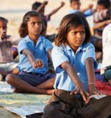 a group of children doing yoga in yoga campaign