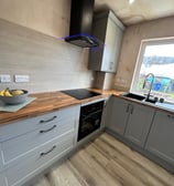 Kitchen with shaker doors in grey with solid wood worktops