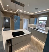 modern kitchen with led lighting and feature ceiling