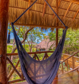 hammock at terrace overlooking garden and ocean