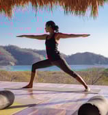 warrior 2 yoga pose in yoga shala retreat center