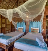twin beds wooden bungalow retreat center Eden on the Chocolata