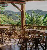 community space overlooking pool and tropical garden