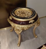 a table with a gold and black table top