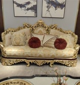 a couch with pillows and pillows on a table
