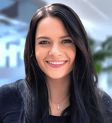 a woman with long hair and a black top