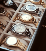 a box of watches with a variety of watches