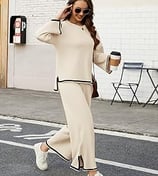 Woman wearing a cozy, lightweight 2-piece travel outfit with a pullover top and wide-leg knit pants.
