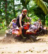a man riding a four - wheeler atv atv atv