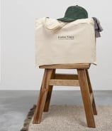 a baggy bag with a hat on top of a stool