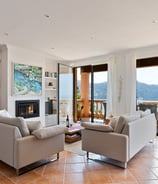 a living room with a fireplace and a fireplace