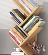 a book shelf with books and a vase with flowers