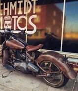 Vintage looking motorcycle in front of window