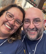 a man and woman smiling and posing for a picture