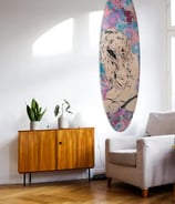 livingroom with Efin surfboard art on wall