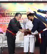 hanshi tetsuo takamiyagi awarding 7th dan to kyoshi lince lince ravi