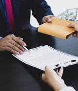 two men getting into a contract of loan against mutual funds showcasing exchange of money against MF