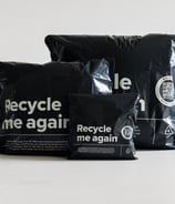 three black recyclable mailers in different sizes
