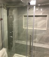 renovated bathroom with glass door standing shower. Basement finishing with bathroom and kitchen.