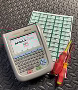 a multi-tester with labels and screwdrivers