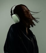 a woman with a noise canceling headphones 