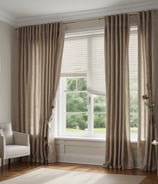An indoor space featuring a vintage television set placed on a decorative stand with an intricate design. On top of the TV, there is an old typewriter, while surrounding it are various potted plants. The background includes a window that looks into another room with hanging lights and patterned tiles visible.