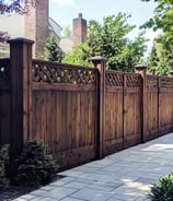 a fence with a lattice design on the top