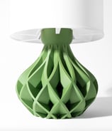a green lamp shade with a white lamp on top