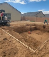 a construction worker is working on a home construction project