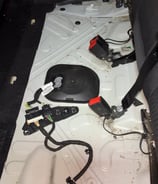 under back seats of a dirty car