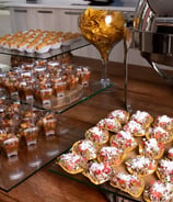 a table with a lot of food and drinks