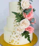 a cake with flowers on top of a yellow plate