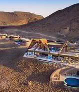 a desert landscape with a pool and a pool
