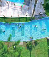 a group of people swimming in a pool