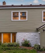 Completed siding and windows by Golden Hammer Construction in Twin Cities