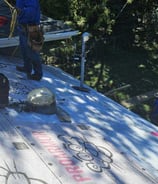 Roofing crew from Golden Hammer Construction installing architectural shingles