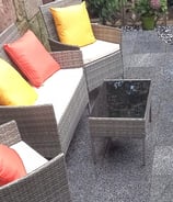 a patio with a couch and a table