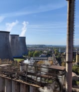 a factory with smoke stacks and smoke stacks