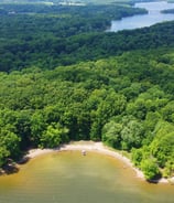 a large body of water with a small island in the middle