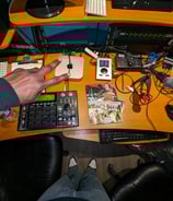 hazema by his studio desk with a keyboard and mouse