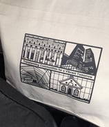 a tote bag with a picture of a cityscape